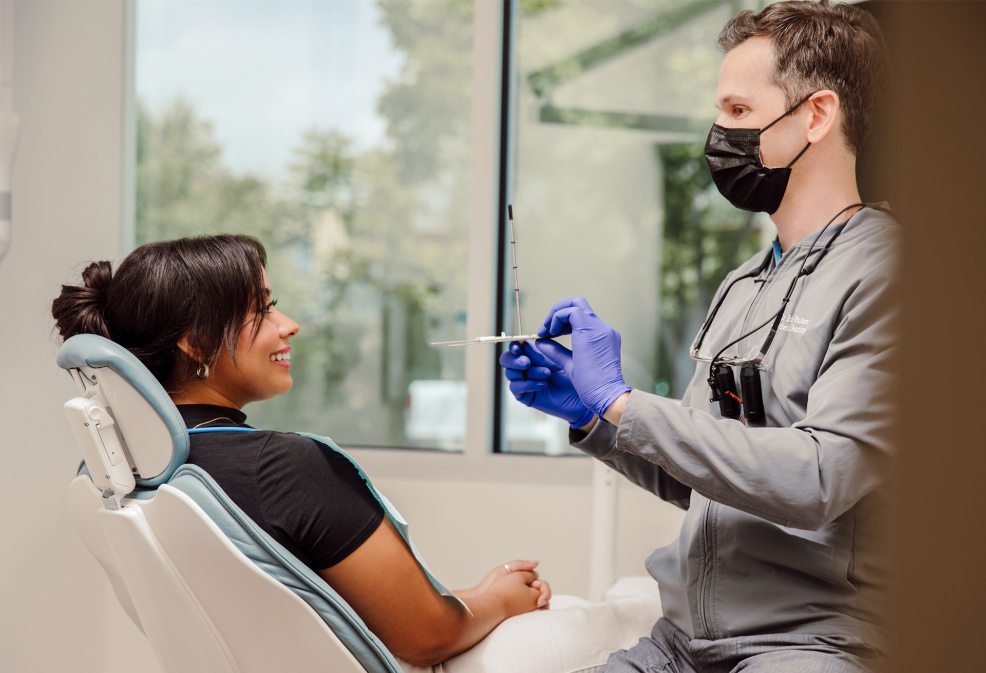 Dentist Talking to Patient