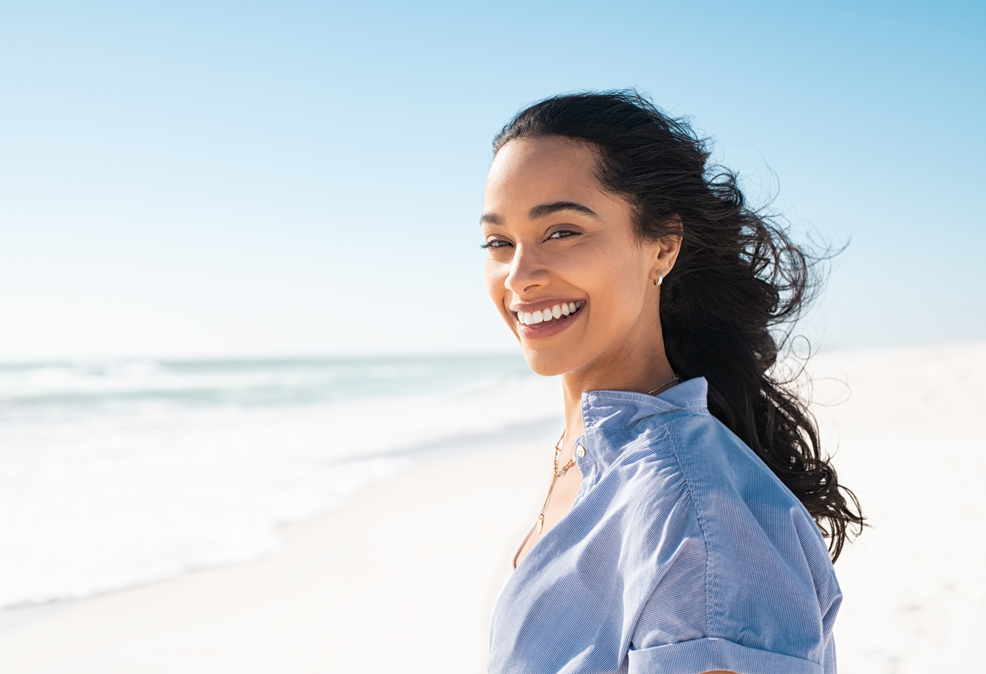 Woman Smiling on the Beach